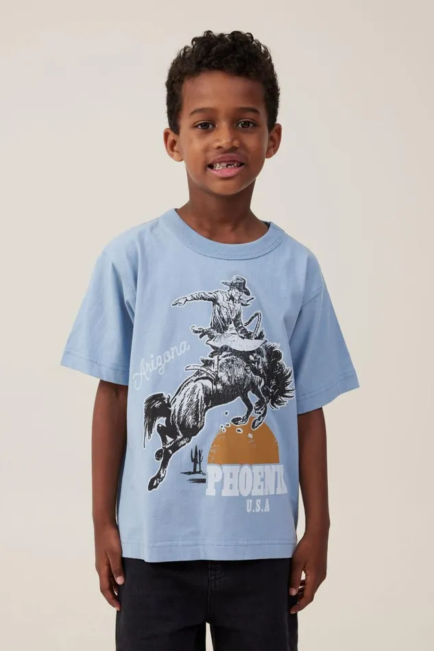 Boys Tops and TShirts Cotton On Jonny Short Sleeve Print Tee Dusty Bluephoenix Cowboy Boys Tops and TShirts Cotton On Jonny Short Sleeve Print Tee Dusty Bluephoenix Cowboy